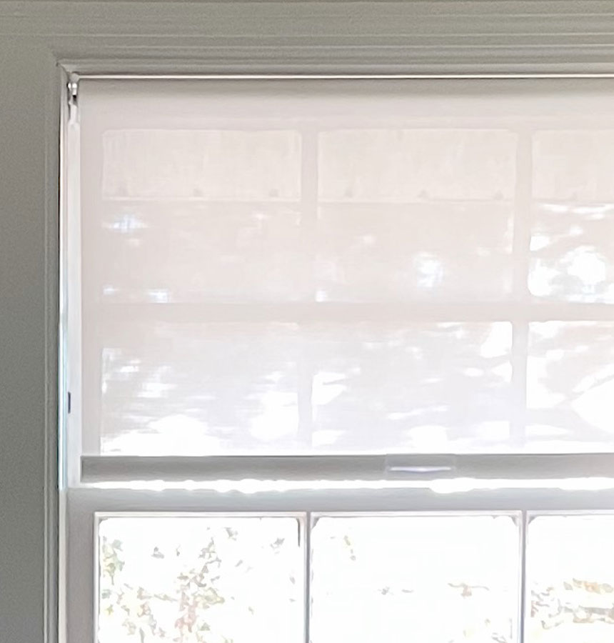 Image of person measuring a window