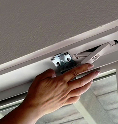 Image of person measuring a window