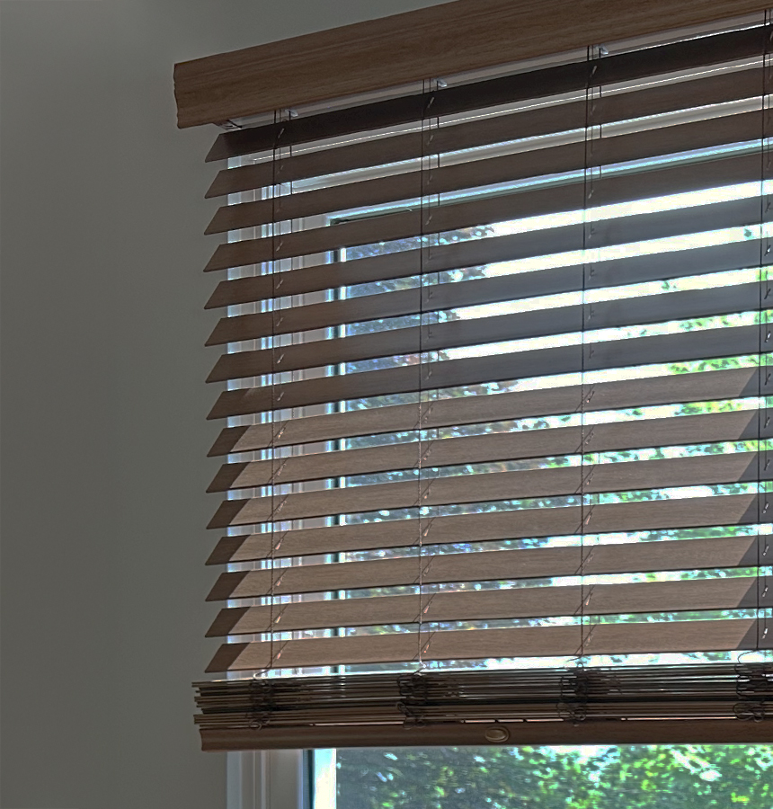 Image of person measuring a window