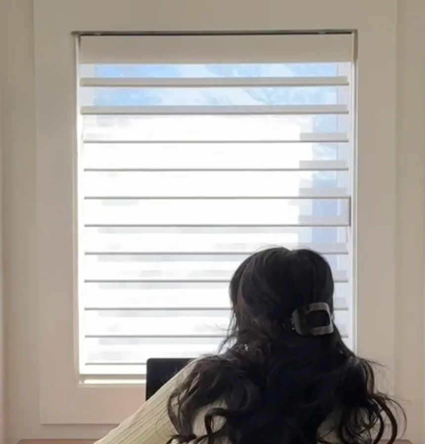 Image of person measuring a window