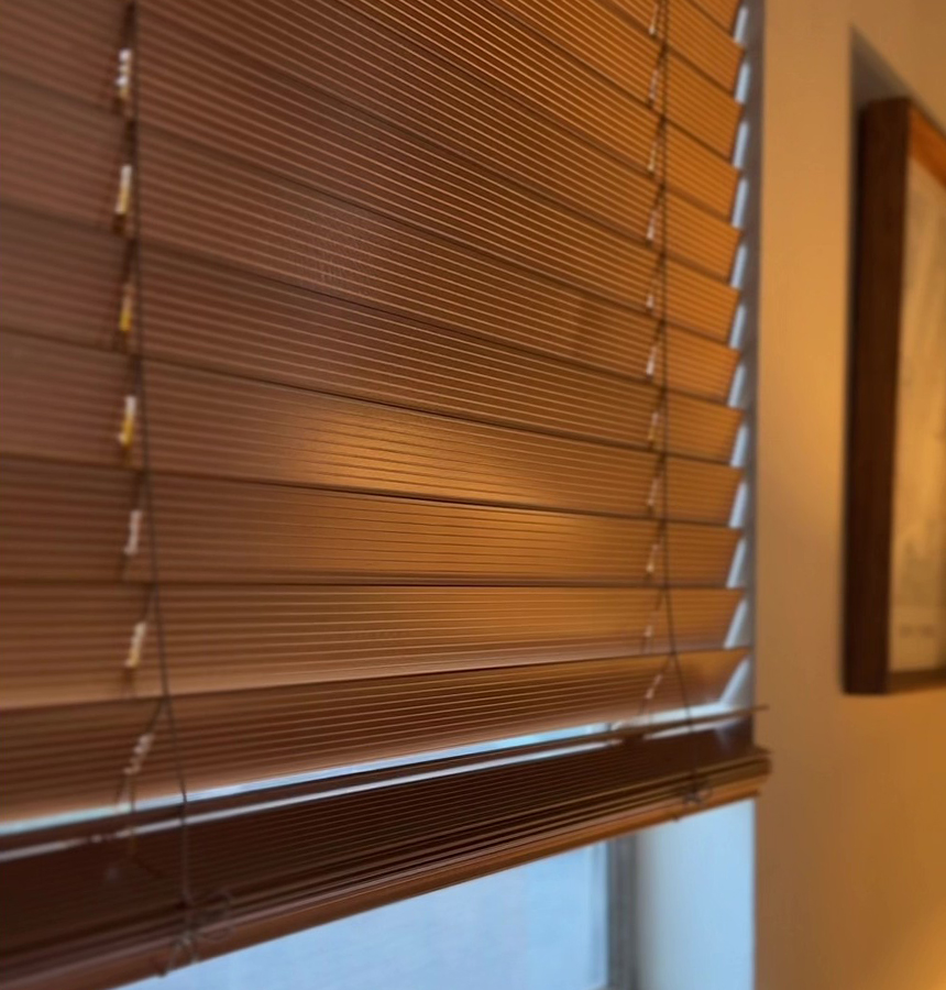 Image of person measuring a window