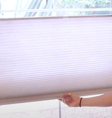 Image of person measuring a window