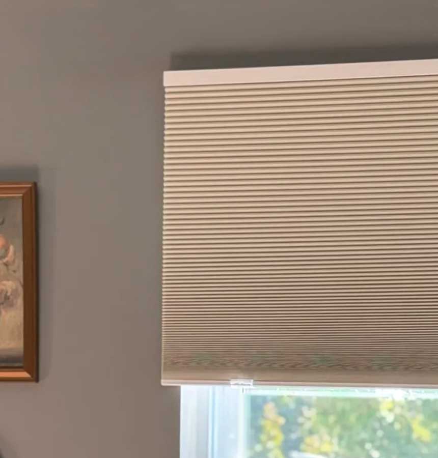 Image of person measuring a window