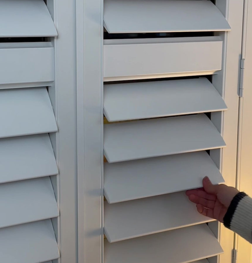 Image of person measuring a window