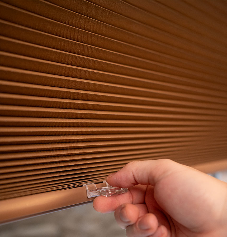 Image of person measuring a window