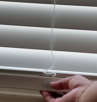Image of person measuring a window