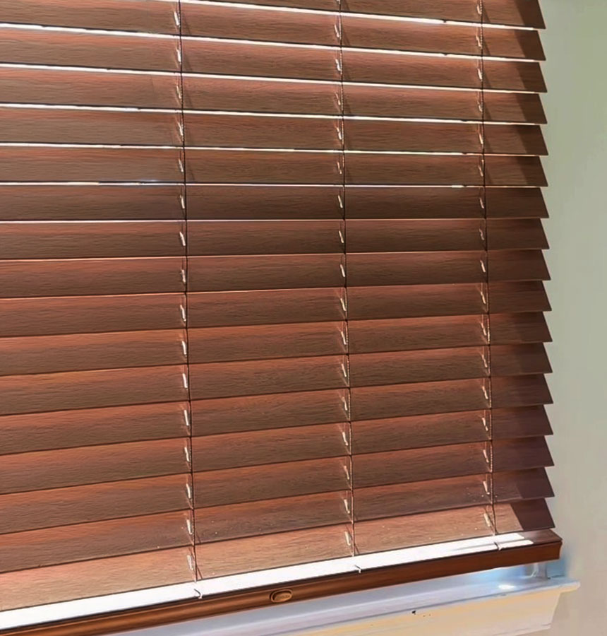 Image of person measuring a window