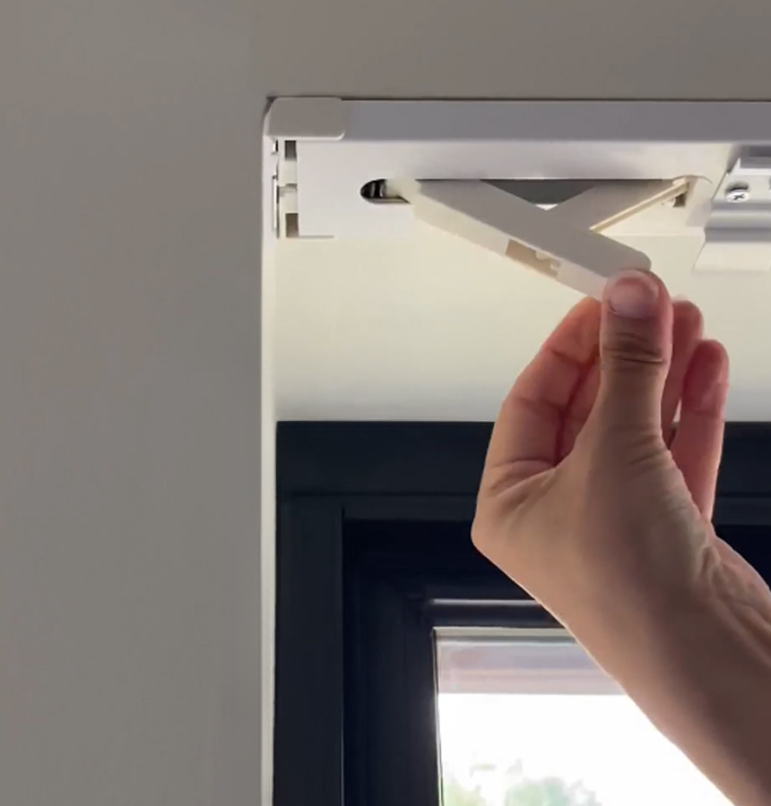 Image of person measuring a window