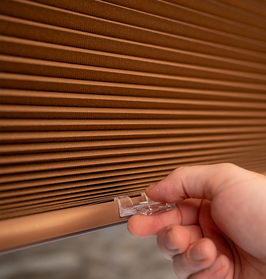 Image of person measuring a window