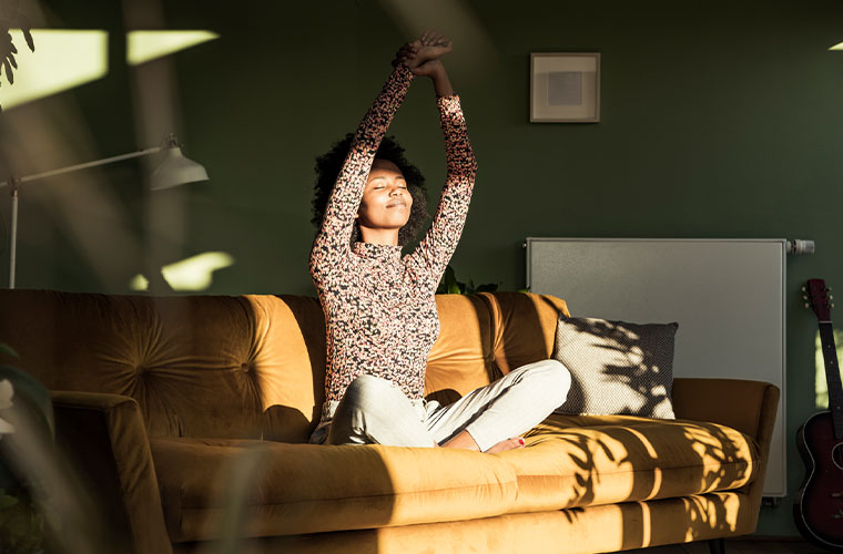 Image of Woman Opening blinds