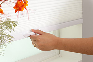 Photo of pulling cordless blinds